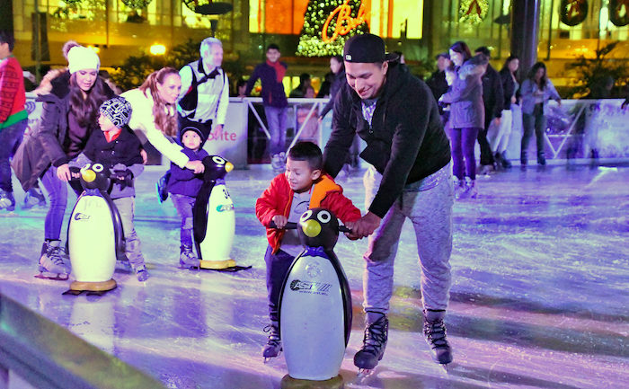 Children ice skating in San Francisco during New Yearโs week