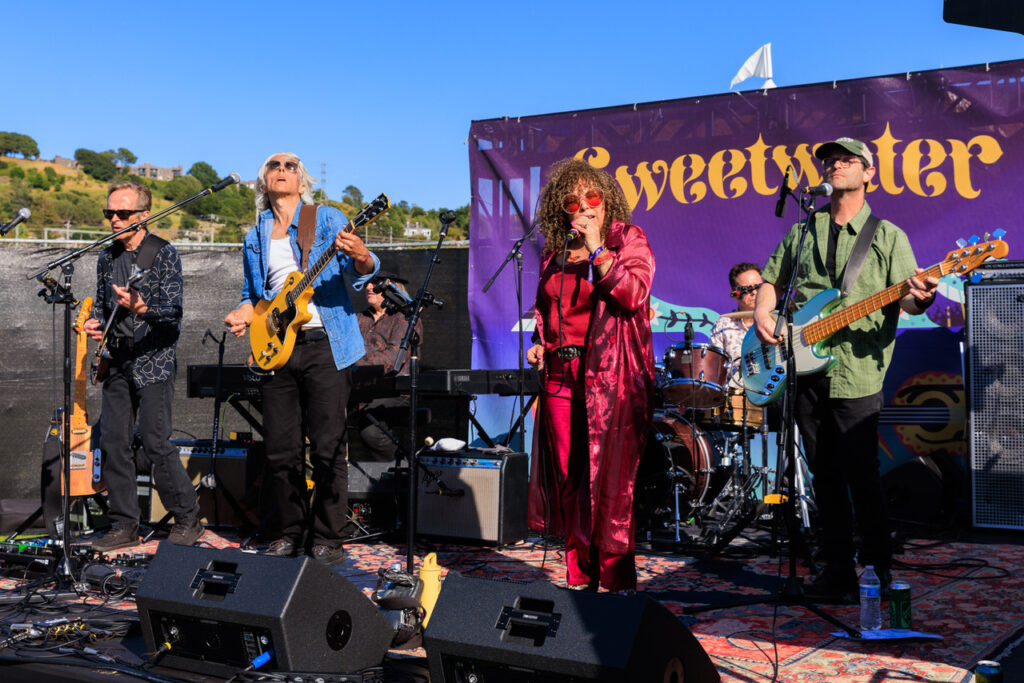 Acoustic folk singer performing in Mill Valley during Labor Day music festivals Bay Area 2025