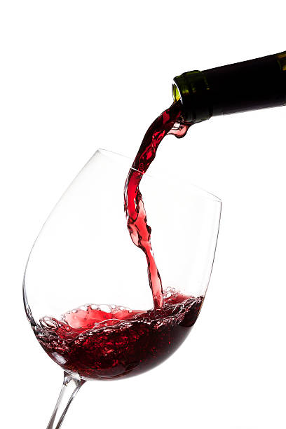 Close-up of a wine pour into a glass