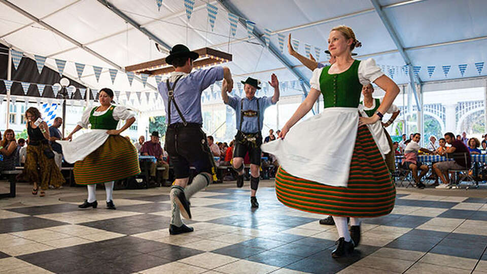 Dancers performing traditional Bavarian folk routines at Oktoberfest by the Bay in San Francisco.