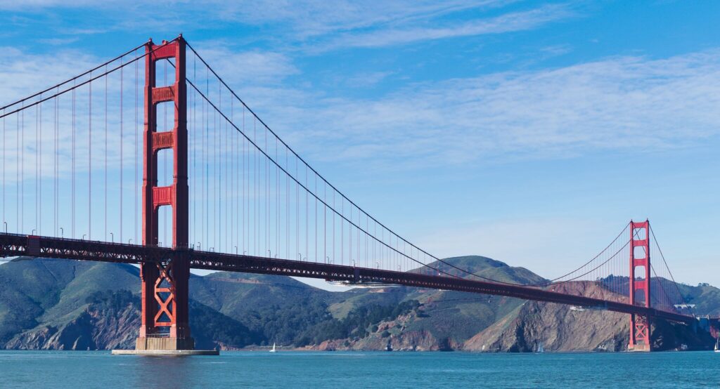 Golden Gate Bridge glowing in the morning light from Crissy Field.