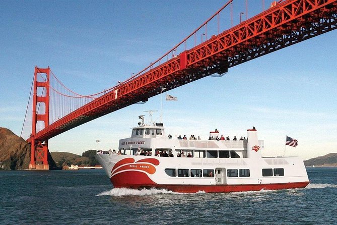 Luxury yacht passing under Golden Gate Bridge during Labor Day boat cruises San Francisco