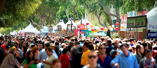 People enjoying diverse street food at San Francisco street fairs September 2025
