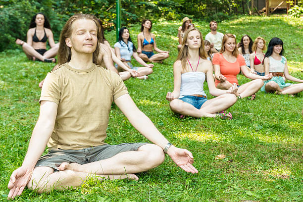 Hippie group practicing meditation or yoga on Hippie Hill.