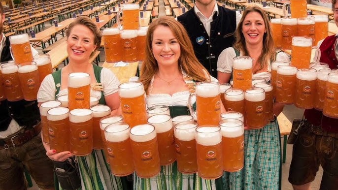 Servers bringing authentic German beer and food to guests at Schroeder’s Oktoberfest