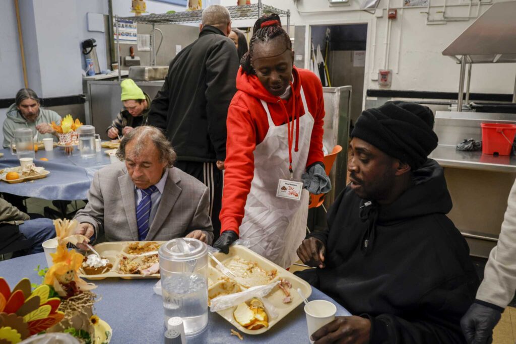 Volunteers serving Thanksgiving dinner at Glide Memorial Church in San Francisco.
